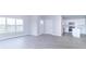 Open concept living room and kitchen area with white cabinets and wood-style flooring at 6210 Fairview Dr, McCordsville, IN 46055