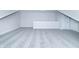 Empty bonus room or loft with gray carpet, white walls, and multiple doorways at 6210 Fairview Dr, McCordsville, IN 46055