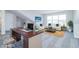 Virtually staged home office or loft space with desk, couch, and natural light at 6210 Fairview Dr, McCordsville, IN 46055