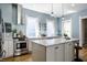 Updated kitchen, featuring stainless steel appliances and blue walls at 1715 Alabama St, Indianapolis, IN 46202