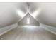 Spacious bonus room with sloped ceilings and window at 1715 Alabama St, Indianapolis, IN 46202