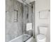 Modern shower with glass enclosure and concrete-look walls at 1715 Alabama St, Indianapolis, IN 46202