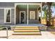 Back porch with wooden steps leading to the ground at 1715 Alabama St, Indianapolis, IN 46202