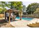 Inviting inground pool with gazebo and slide at 1715 Alabama St, Indianapolis, IN 46202