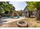 Inviting backyard oasis featuring a refreshing pool, slide, gazebo, and fire pit at 1715 Alabama St, Indianapolis, IN 46202