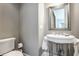 Small half bathroom with pedestal sink and toilet at 1715 Alabama St, Indianapolis, IN 46202