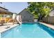 Relaxing pool with a slide in a fenced backyard setting at 1715 Alabama St, Indianapolis, IN 46202