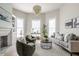 Spacious living room with bay windows and stylish furniture at 1715 Alabama St, Indianapolis, IN 46202