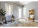 Bright home office features hardwood floors and a window at 1715 Alabama St, Indianapolis, IN 46202