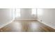 Bright bedroom with hardwood floors and two windows at 1715 Alabama St, Indianapolis, IN 46202