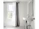 Simple bathroom with pedestal sink and window at 1715 Alabama St, Indianapolis, IN 46202