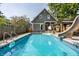 Escape to this refreshing backyard pool with a slide and spacious deck at 1715 Alabama St, Indianapolis, IN 46202