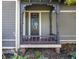 Charming front porch with stained wood and decorative railing at 1715 Alabama St, Indianapolis, IN 46202