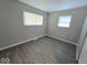 Neutral-toned bedroom with gray walls and vinyl flooring at 4050 Byram Ave, Indianapolis, IN 46208