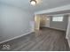 Finished basement with gray flooring and an exterior door at 4050 Byram Ave, Indianapolis, IN 46208