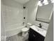 Updated bathroom with white subway tile and a dark vanity at 4050 Byram Ave, Indianapolis, IN 46208