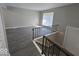Open living area with gray flooring and a split-level design at 4050 Byram Ave, Indianapolis, IN 46208
