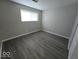 Spacious bedroom with neutral gray walls and flooring at 4050 Byram Ave, Indianapolis, IN 46208