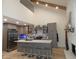 Modern kitchen with island, white countertops, and stainless steel appliances at 7419 Sylvan Ridge Rd, Indianapolis, IN 46240