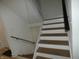 Contemporary staircase featuring a sleek cable railing at 7419 Sylvan Ridge Rd, Indianapolis, IN 46240