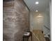 Entryway with wood-paneled accent wall and a small table at 7419 Sylvan Ridge Rd, Indianapolis, IN 46240