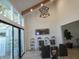 Dining room with glass table, chairs, and large windows at 7419 Sylvan Ridge Rd, Indianapolis, IN 46240