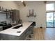 Eat-in kitchen with white stone fireplace and modern cabinets at 7419 Sylvan Ridge Rd, Indianapolis, IN 46240