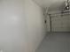 Attached garage with painted floor and opener at 7419 Sylvan Ridge Rd, Indianapolis, IN 46240