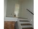 Modern staircase with cable railing system and wood treads at 7419 Sylvan Ridge Rd, Indianapolis, IN 46240