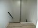 Modern staircase with cable railing and wood steps at 7419 Sylvan Ridge Rd, Indianapolis, IN 46240
