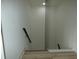 Contemporary staircase featuring a sleek cable railing at 7419 Sylvan Ridge Rd, Indianapolis, IN 46240