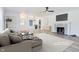 Virtually staged living room with hardwood floors and fireplace at 8480 S Honeycreek Rd, Muncie, IN 47302