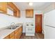 Kitchen boasts wood cabinets and modern appliances at 5648 N Keystone Ave, Indianapolis, IN 46220
