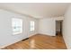 Simple living room featuring hardwood floors and neutral walls at 5648 N Keystone Ave, Indianapolis, IN 46220