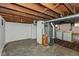 Unfinished basement with laundry hookups and storage space at 5648 N Keystone Ave, Indianapolis, IN 46220