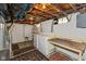 Unfinished basement with washer, dryer and workbench at 5648 N Keystone Ave, Indianapolis, IN 46220