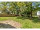 Large backyard with a grassy area and wooden fence at 5648 N Keystone Ave, Indianapolis, IN 46220