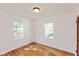 Bedroom featuring hardwood floors and ample natural light at 5648 N Keystone Ave, Indianapolis, IN 46220