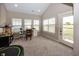 Sunroom with a view, featuring a workspace and a trampoline at 1569 Tupelo Dr, Greenfield, IN 46140