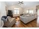 Spacious living room with hardwood floors, vaulted ceiling and a cozy seating area at 1569 Tupelo Dr, Greenfield, IN 46140