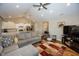 Open concept living room with hardwood floors, vaulted ceiling, and kitchen views at 1569 Tupelo Dr, Greenfield, IN 46140