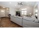 Open concept living room with hardwood floors and large sectional sofa at 1569 Tupelo Dr, Greenfield, IN 46140