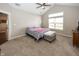 Bright bedroom featuring a large window and plush carpeting at 1569 Tupelo Dr, Greenfield, IN 46140