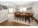 Formal dining room with hardwood floors, large table, and natural light at 1569 Tupelo Dr, Greenfield, IN 46140