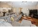 Open concept living area with hardwood floors and a sectional sofa at 1569 Tupelo Dr, Greenfield, IN 46140