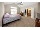 Spacious bedroom with carpeted floors and ensuite bathroom access at 1569 Tupelo Dr, Greenfield, IN 46140