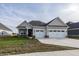 Craftsman style home with two-car garage and front porch at 1569 Tupelo Dr, Greenfield, IN 46140