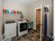 Convenient laundry room with washer, dryer, and storage at 1569 Tupelo Dr, Greenfield, IN 46140