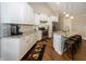 Modern kitchen with granite countertops, stainless steel appliances, and white cabinets at 1569 Tupelo Dr, Greenfield, IN 46140
