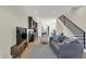 Bright living room boasts hardwood floors and an open floor plan with kitchen access at 417 E Morris St, Indianapolis, IN 46225